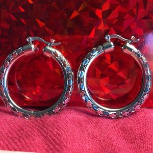 Lightweight silver color diamond cut earrings.